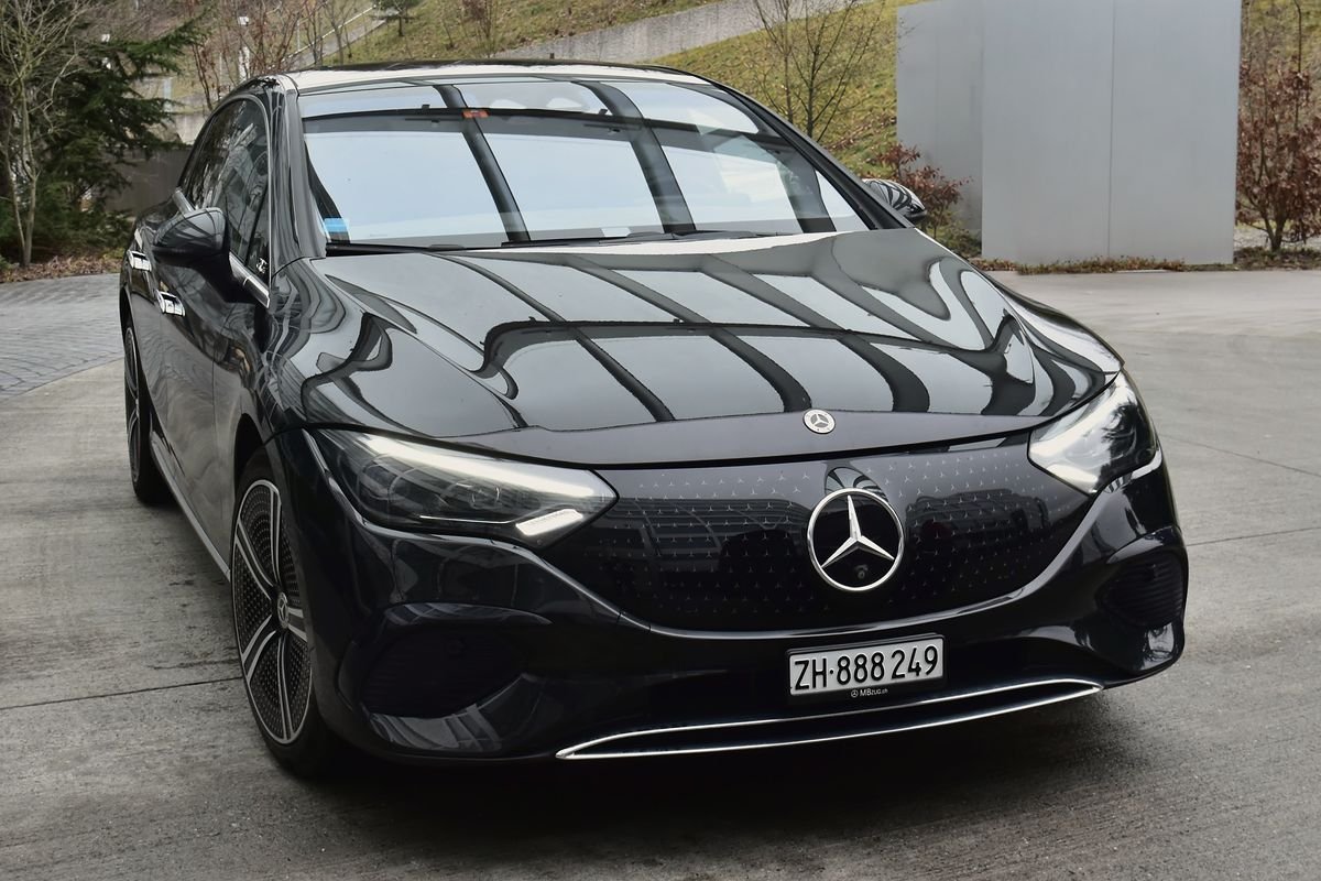 Business Sedan: black Mercedes EQE at a hotel entrance near Zurich Airport