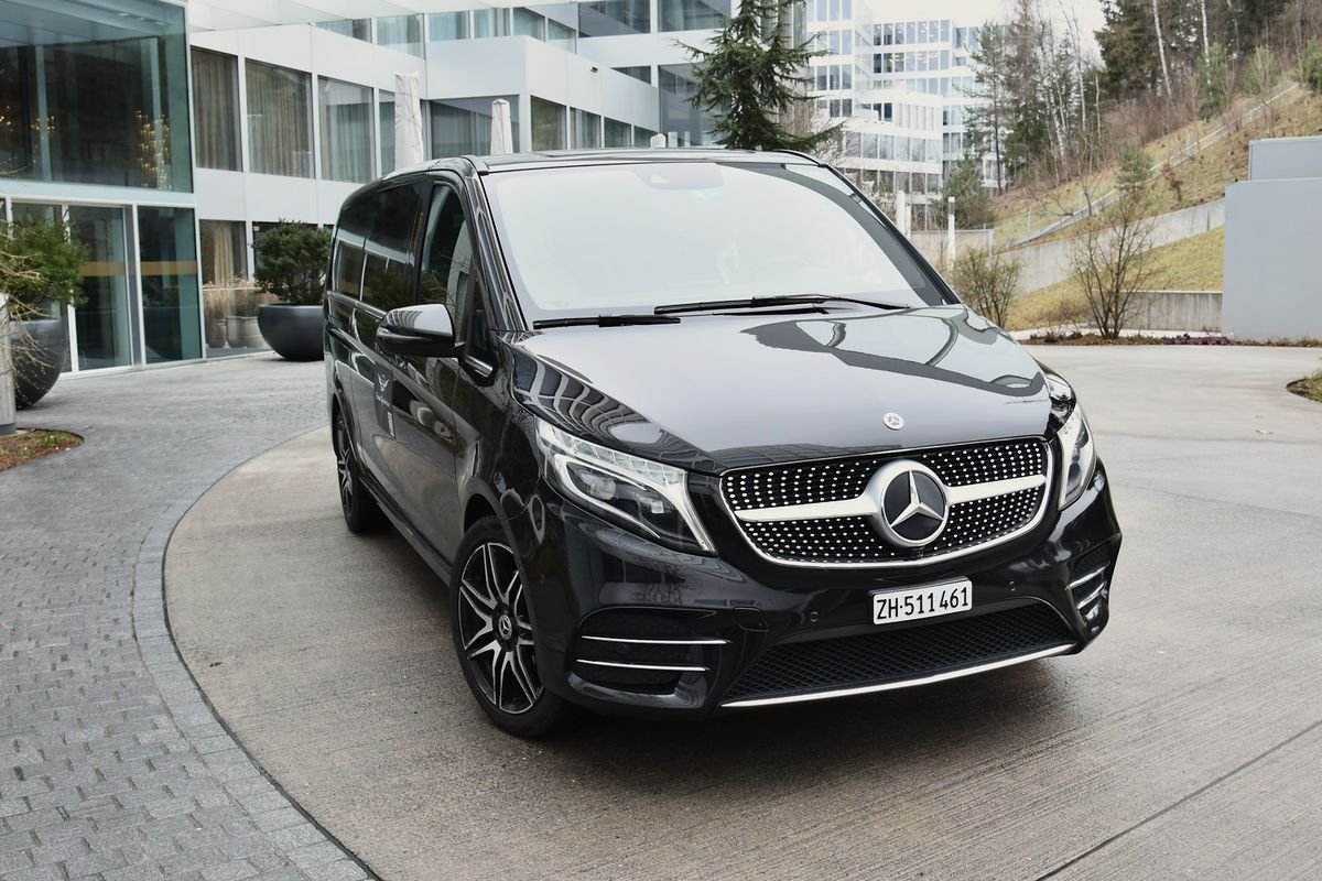Business Van: black Mercedes V-Class at a hotel entrance near Zurich Airport