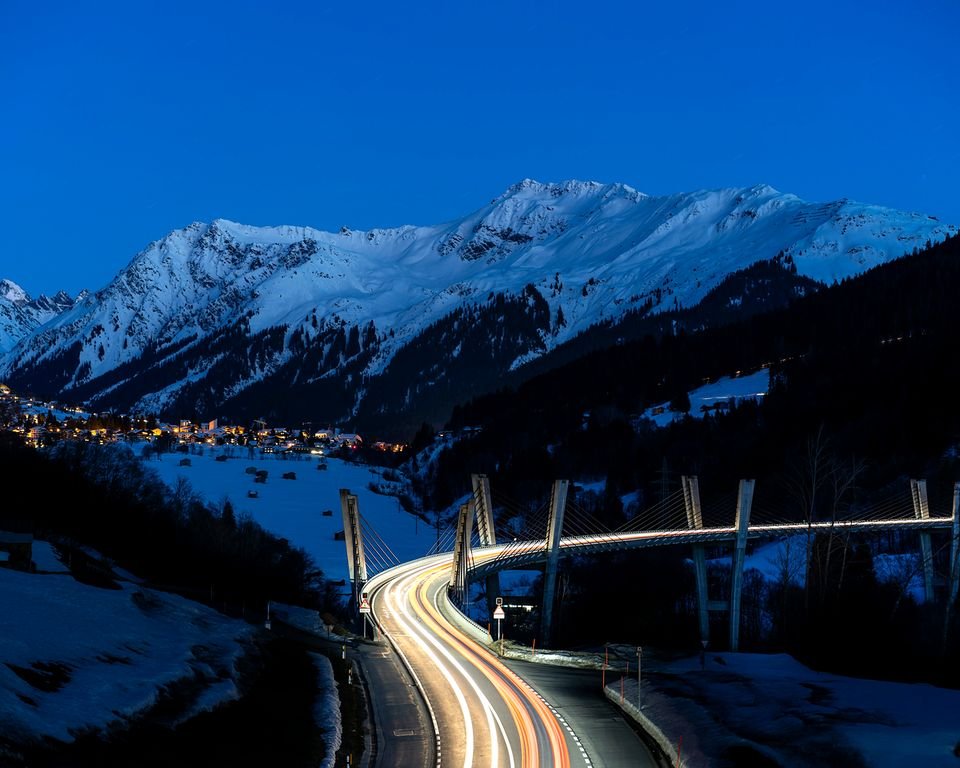 The road to Davos in winter: the Sunniberg bridge near Klosters at dusk