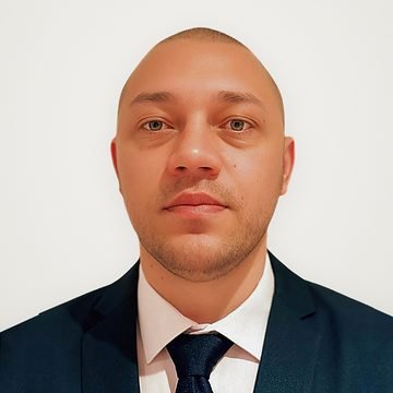 Express Transfer chauffeur in a navy suit and tie