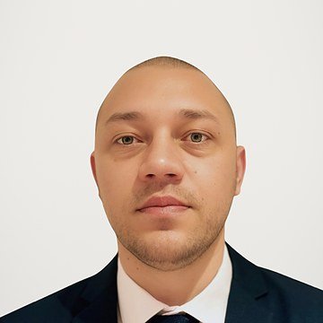 Express Transfer chauffeur in a navy suit and tie