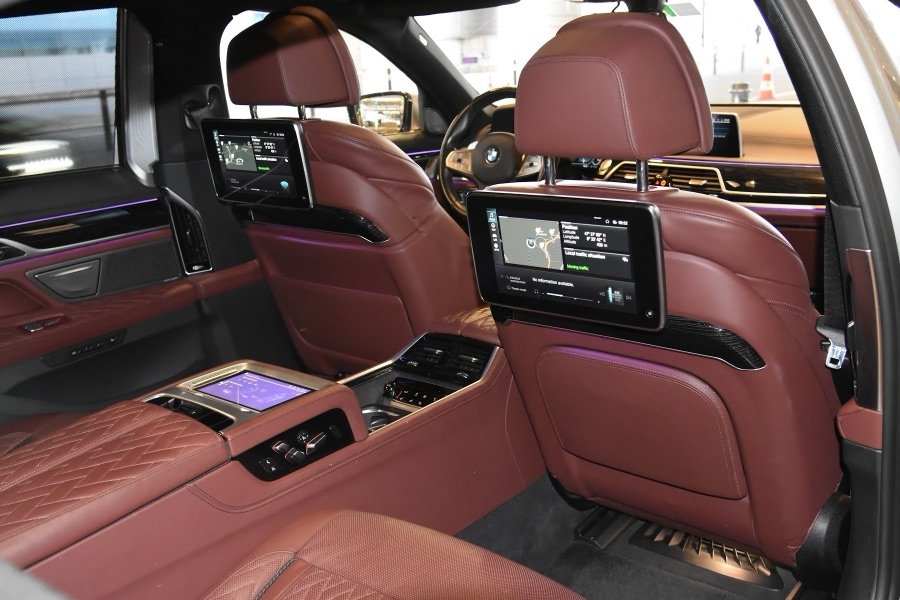 First Class rear cabin in burgundy leather with rear-seat screens