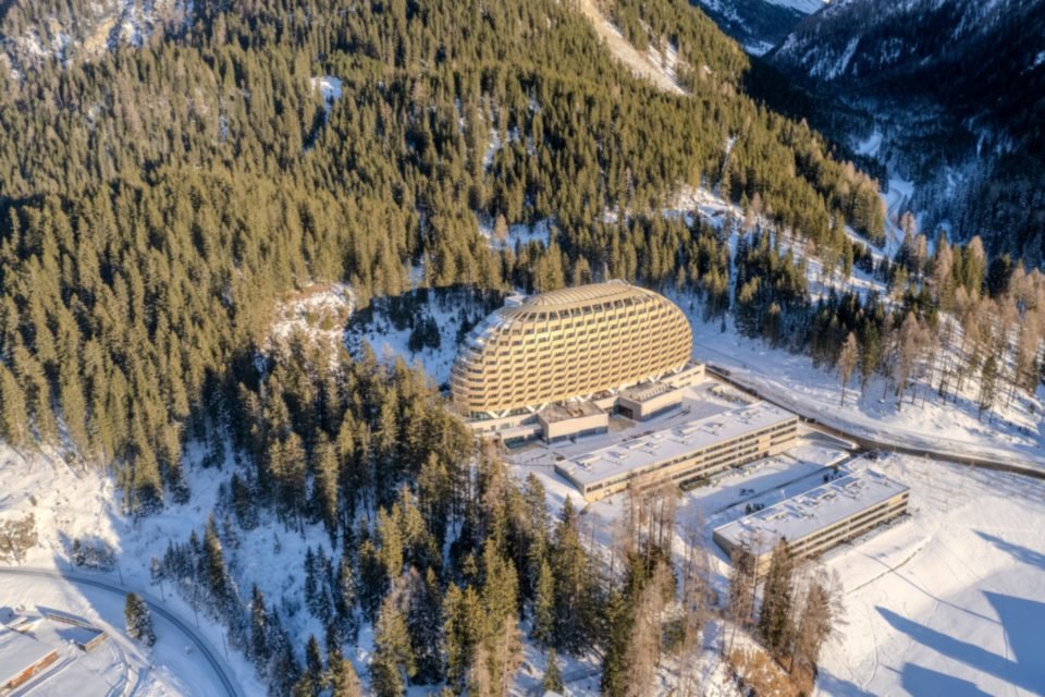The AlpenGold Hotel in the forest above Davos in winter, seen from above
