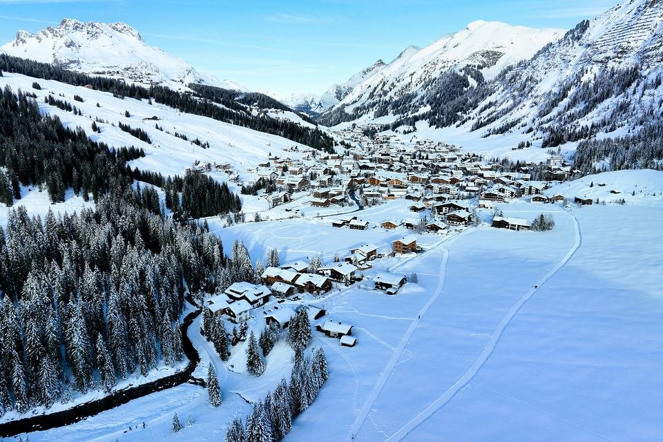 Lech am Arlberg in winter from above: the village between snowy mountains