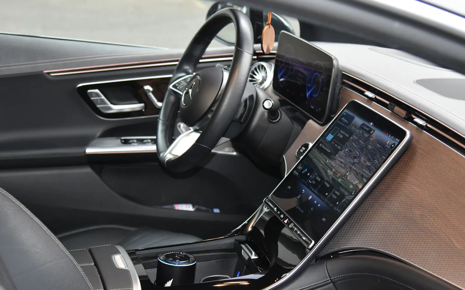 Mercedes EQE front cabin with dashboard and centre display.